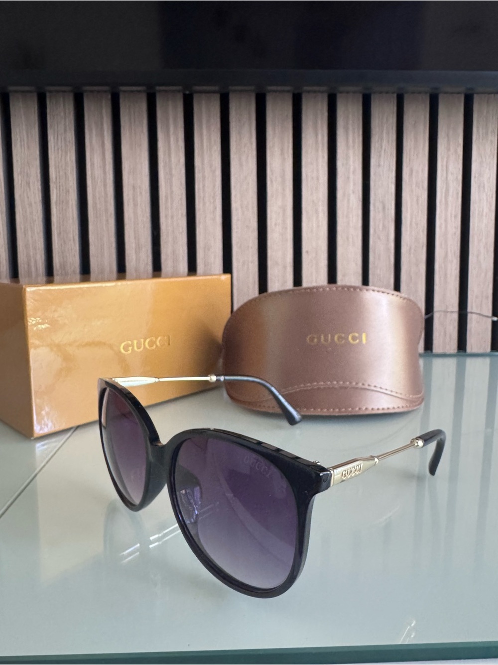 Gucci Black Frame Sunglasses with Purple Lenses
